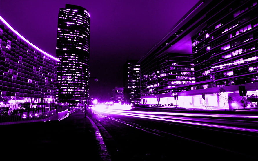Vibrant Purple Cityscape at Night with Long Exposure Light Trails and Modern Skyscrapers HD wallpaper