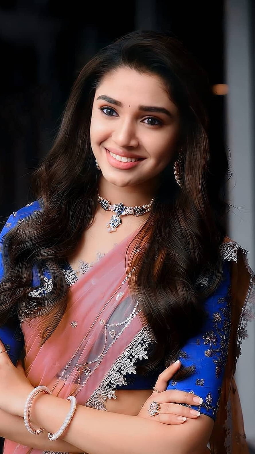 Bhavna Bajaj in a stunning blue and pink saree with traditional jewelry and a radiant smile HD phone wallpaper