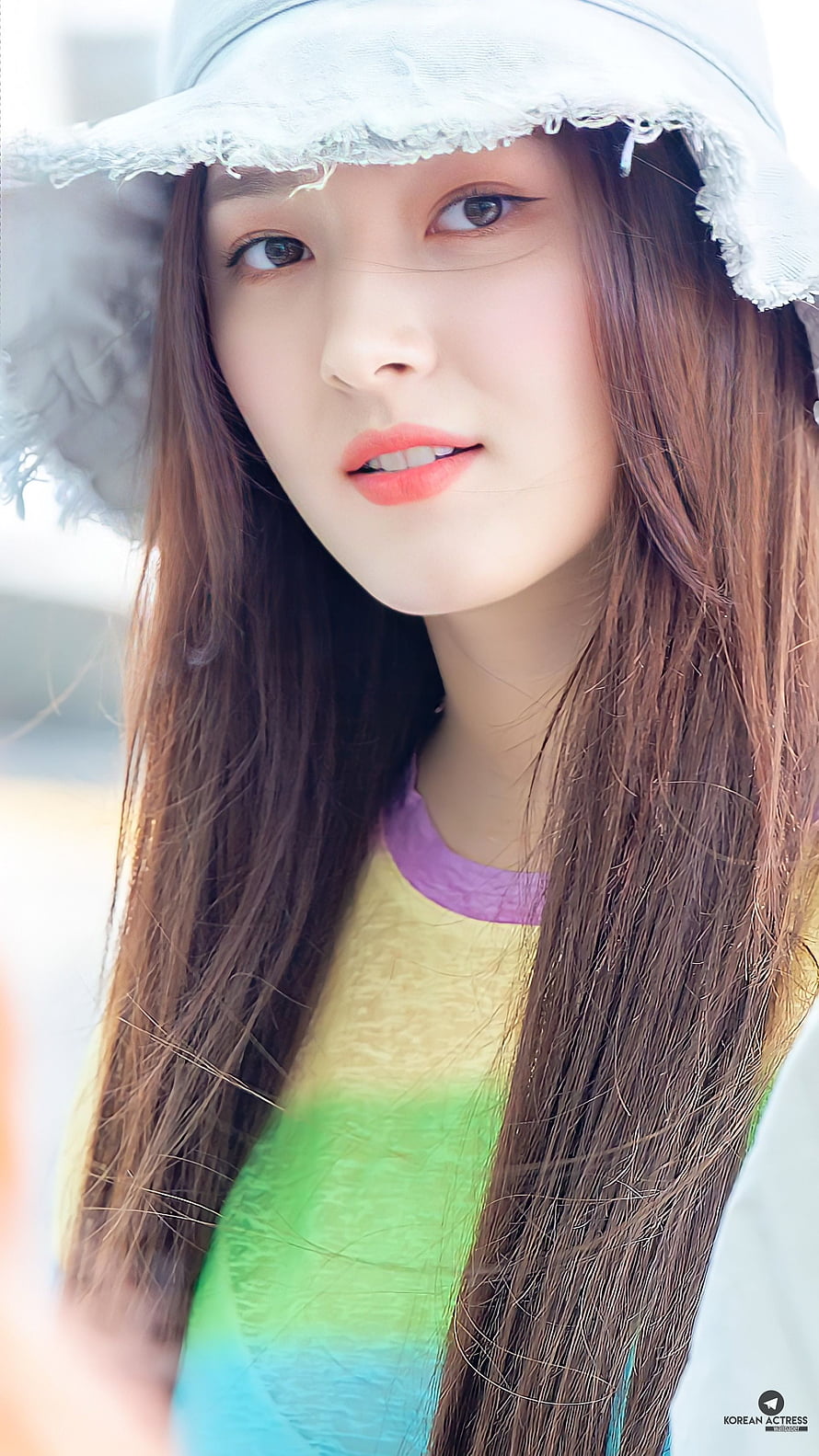 Seulgi wearing a white bucket hat and colorful striped shirt HD phone wallpaper