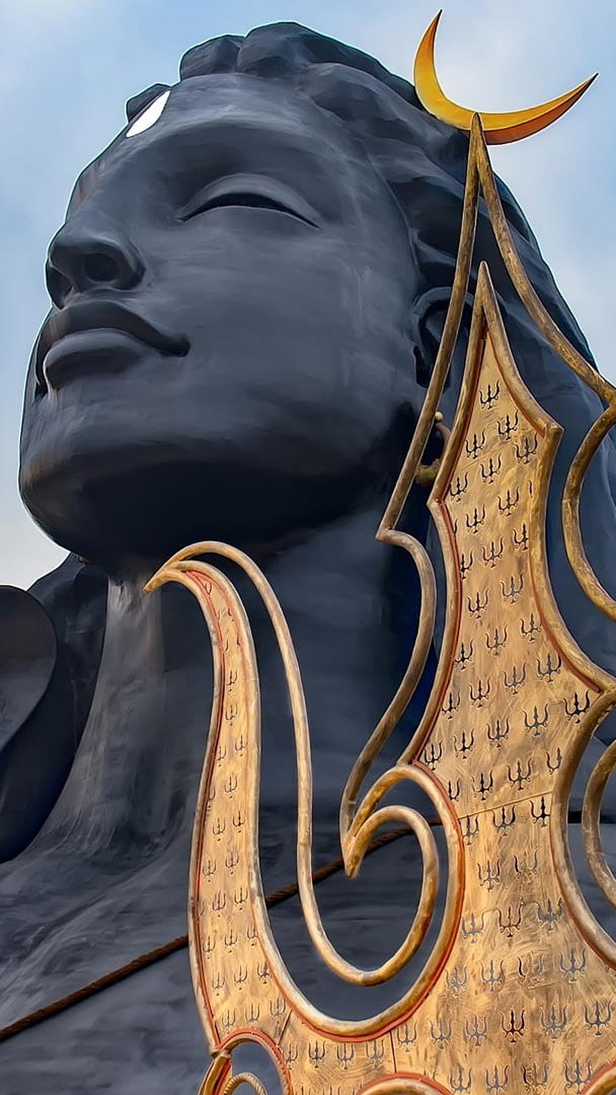 Giant Black Statue of Lord Shiva with Golden Trishul and Crescent Moon HD phone wallpaper