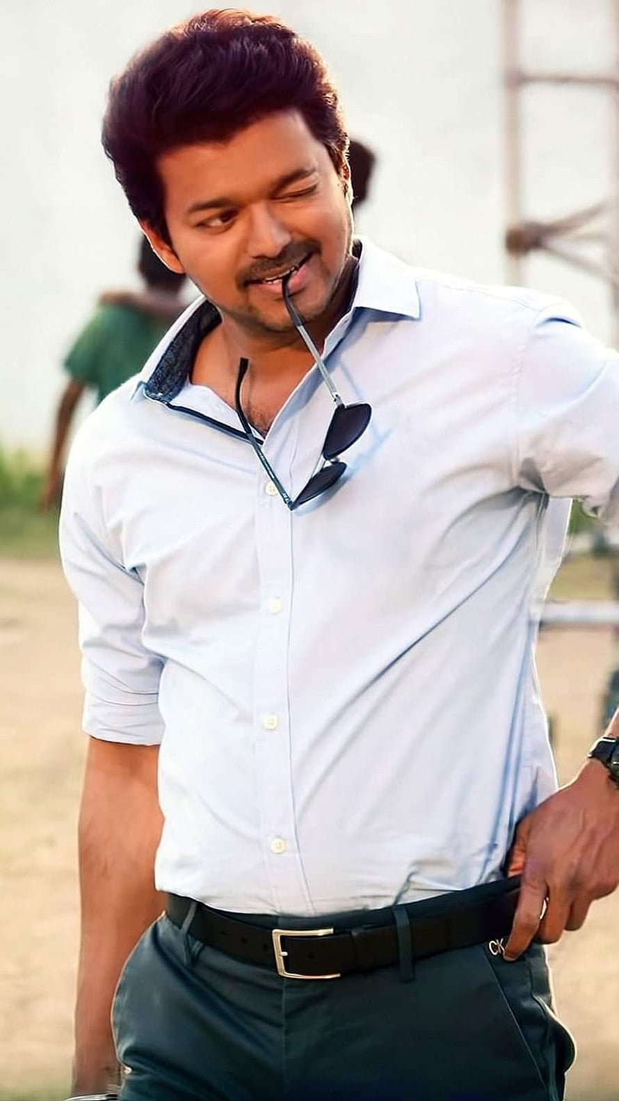 Vijay in Light Blue Shirt with Sunglasses Hanging from Collar HD phone wallpaper