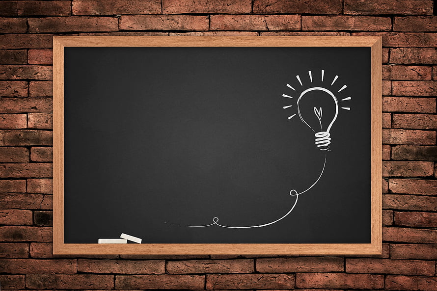 Chalkboard with Lightbulb Sketch on Rustic Brick Wall HD wallpaper