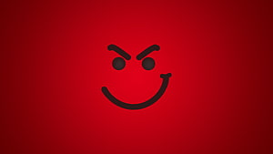 Angry Smiley Face Icon on Deep Red Gradient Background HD wallpaper