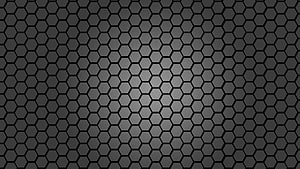 Dark Geometric Honeycomb Pattern with Central Radial Gradient HD wallpaper