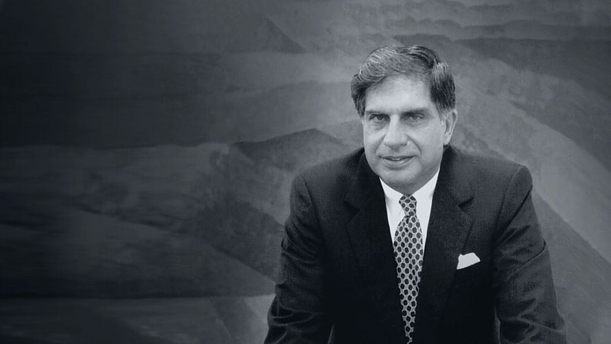 Ratan Tata in a formal suit and patterned tie against a textured studio backdrop HD wallpaper