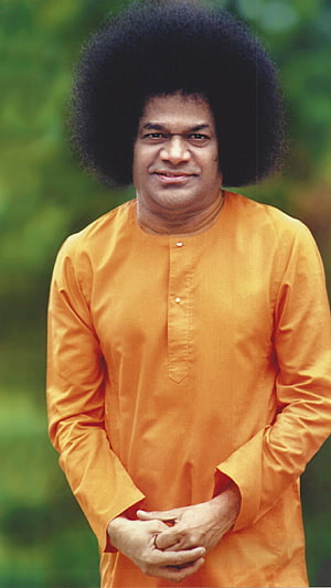 Sathya Sai Baba Portrait in Traditional Orange Kurta with Large Afro Hair HD phone wallpaper