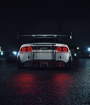 Rear View of Modified Nissan 380SX Sports Car with Large Rear Wing at Night HD phone wallpaper
