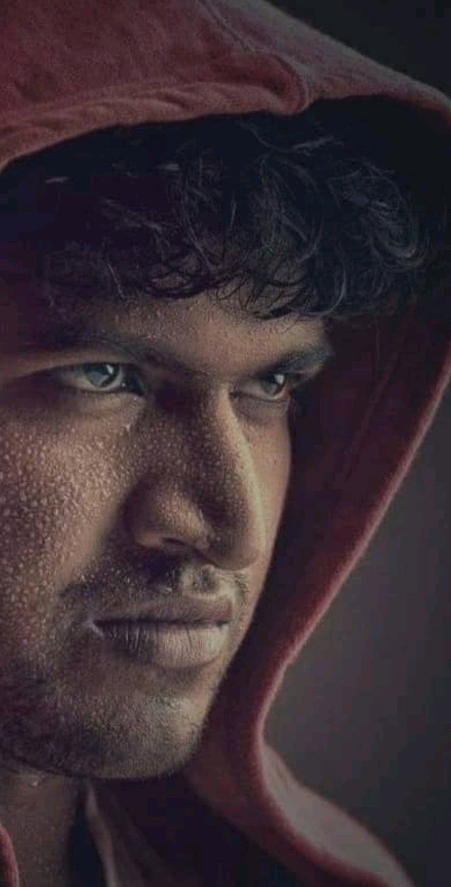 Portrait of a man with curly hair wearing a red hooded sweatshirt, Puneeth Rajkumar, handsome, face, Nose, raw HD phone wallpaper