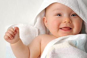 Smiling Baby Boy Wrapped In A Soft White Towel HD wallpaper
