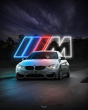 White BMW M4 F82 with Neon M Logo Under Starry Night Sky HD phone wallpaper
