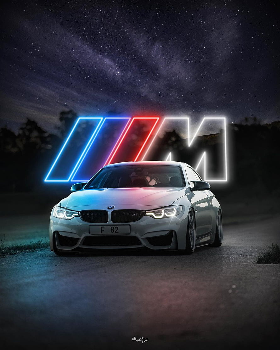 White BMW M4 F82 with Neon M Logo Under Starry Night Sky HD phone wallpaper
