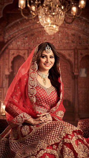 Elegant Indian Bride in Red and Gold Lehenga with Traditional Jewelry HD phone wallpaper