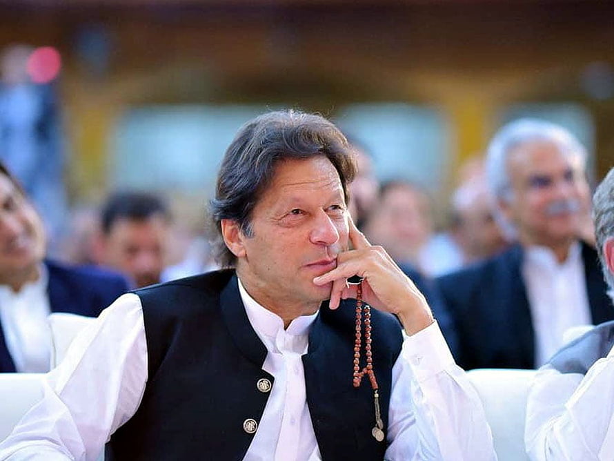 Imran Khan in Black Waistcoat and White Shirt Holding Prayer Beads HD wallpaper