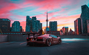 Lamborghini Aventador SVJ in Toronto with CN Tower at Sunset HD wallpaper