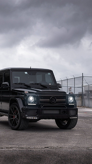 Black Mercedes-Benz G63 AMG G-Wagon with Brabus Grille Under Stormy Sky HD phone wallpaper