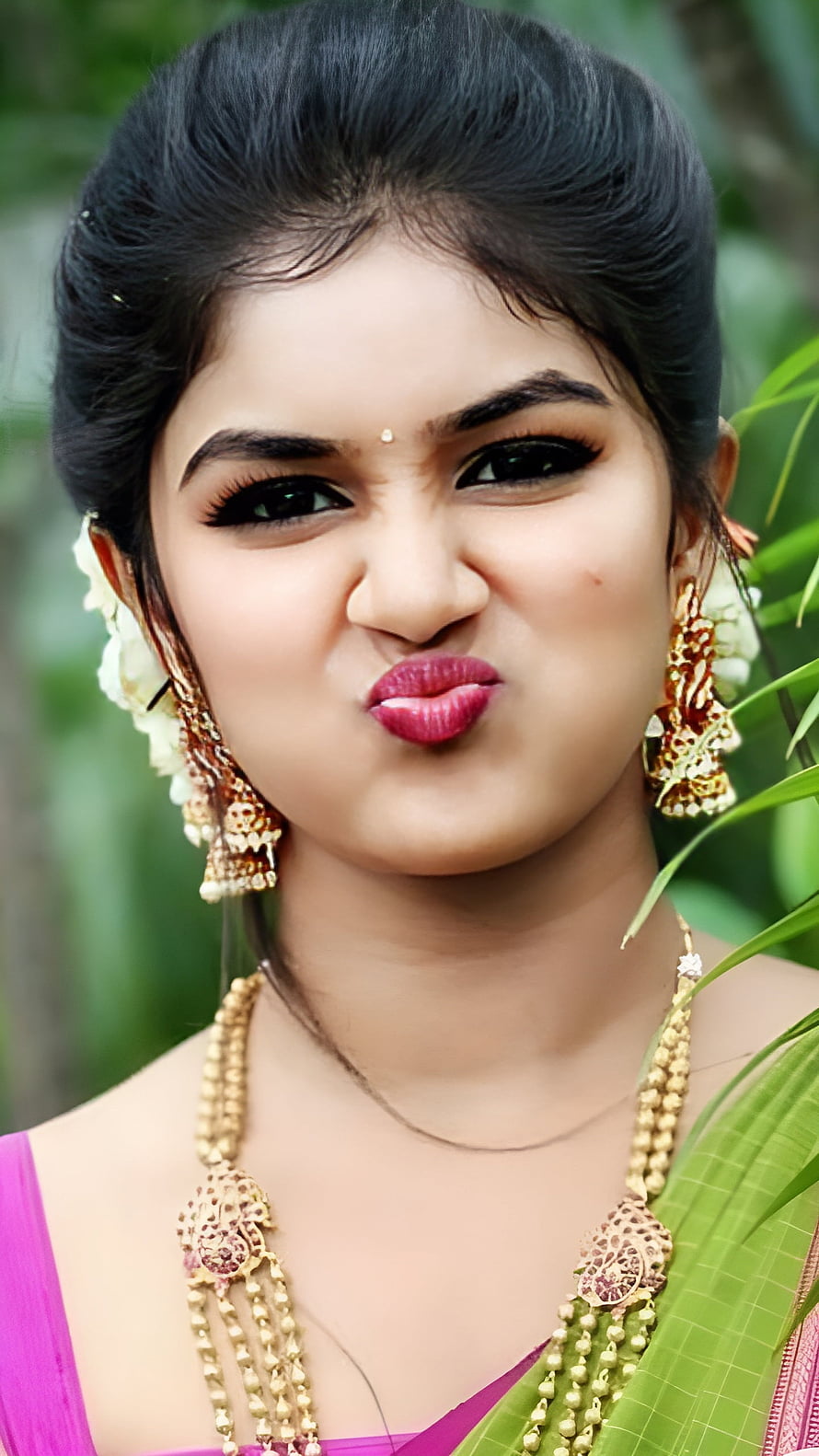 Sreeleela in Traditional Saree with Gold Jewelry and Floral Hair Accessories HD phone wallpaper