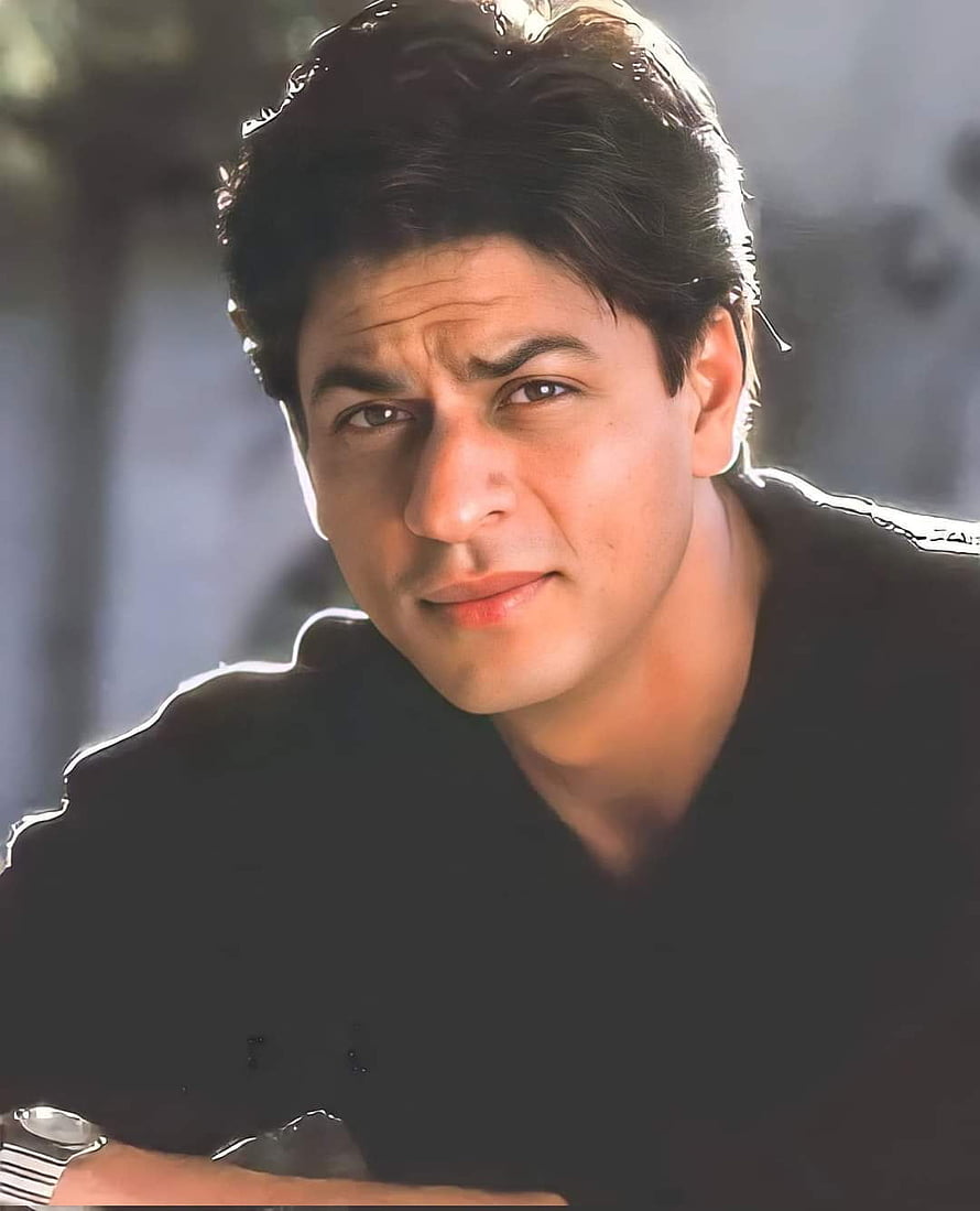 Shah Rukh Khan Portrait in Black Shirt with Intense Gaze and Soft Lighting HD phone wallpaper
