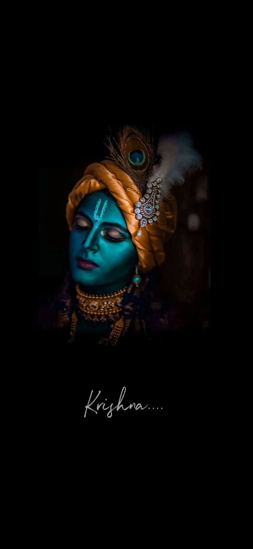 Serene Blue Skinned Krishna Portrait With Peacock Feather Turban And Gold Jewelry HD phone wallpaper