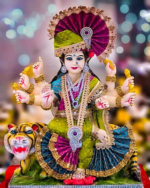 Colorful Durga Puja Idol with Tiger Vahan and Ornate Jewelry HD phone wallpaper