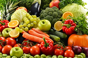 Vibrant Fresh Produce Arrangement Featuring Carrots, Tomatoes, and Citrus Fruits HD wallpaper