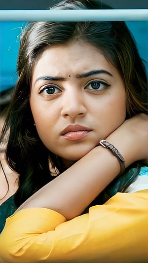 Nazriya Nizam Portrait in Yellow Top with Intense Gaze HD phone wallpaper