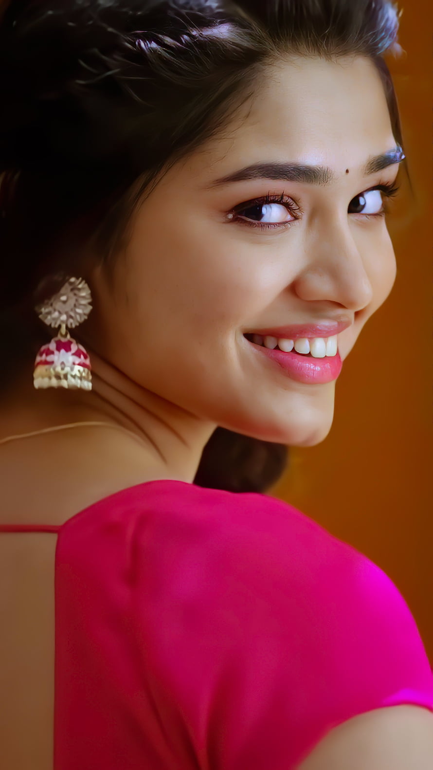 Portrait of a smiling woman in a vibrant pink dress with traditional earrings, Kriti Shetty, head, nose, Kriti_Shetty HD phone wallpaper