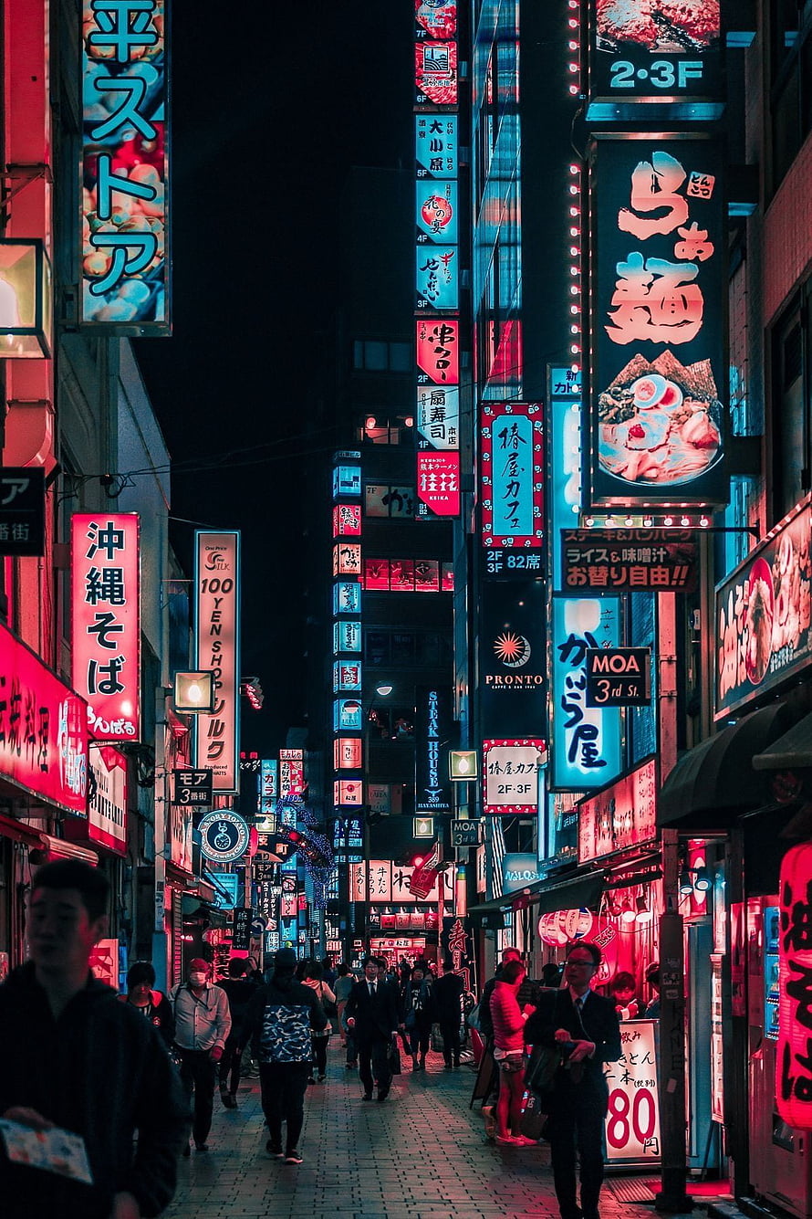 Neon-Lit Tokyo Street at Night with Vibrant Japanese Signage and Crowds HD phone wallpaper