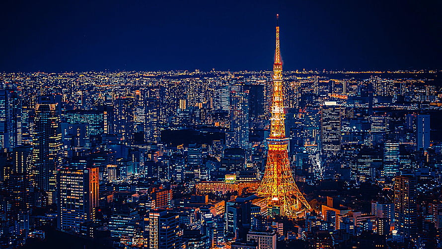 Tokyo Skyline at Night with Tokyo Tower Illuminated Against a Deep Blue Sky HD wallpaper