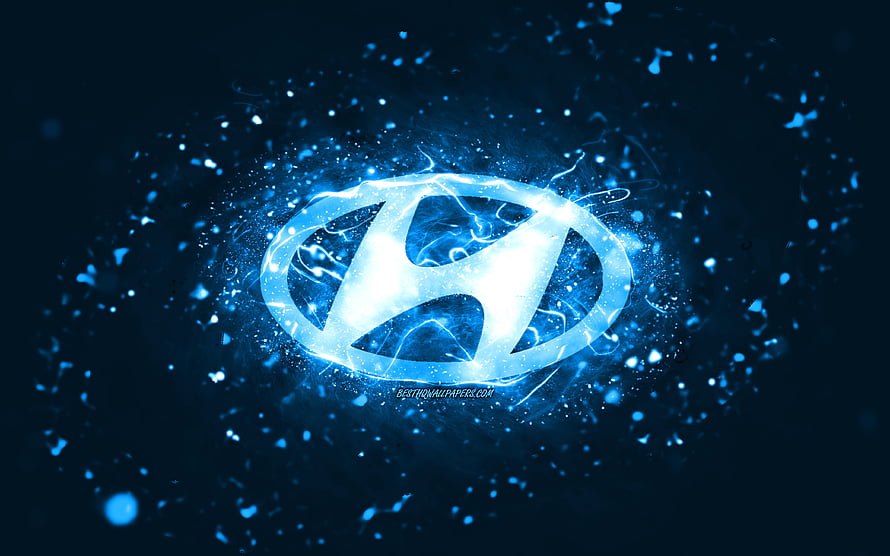 Glowing Hyundai Emblem With Electric Blue Energy Burst And Particle Effects HD wallpaper