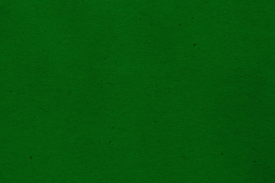 Dark Green Textured Paper Background with Subtle Grain and Speckles HD wallpaper