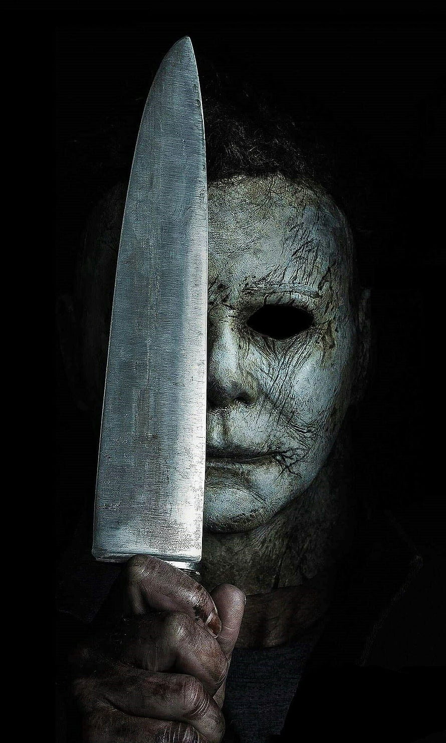 Michael Myers from Halloween Holding a Large Kitchen Knife in Dark Horror Artwork HD phone wallpaper