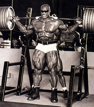 Ronnie Coleman performing a heavy barbell squat in a vintage black and white bodybuilding photo, Ronnie Coleman - ( collections) HD phone wallpaper
