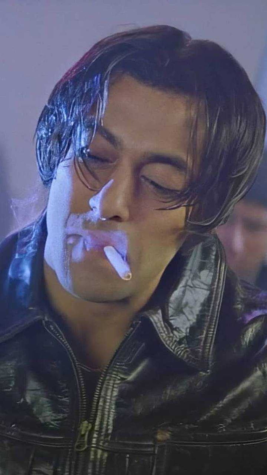 Aamir Khan in a leather jacket smoking a cigarette with eyes closed HD phone wallpaper