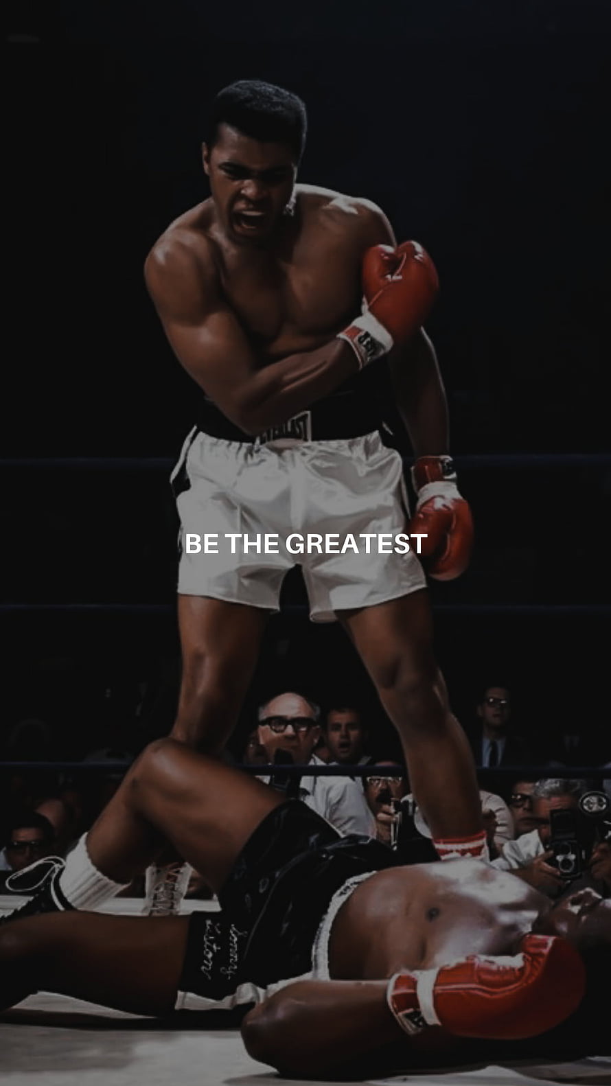 Muhammad Ali standing over fallen opponent in boxing ring with motivational quote HD phone wallpaper