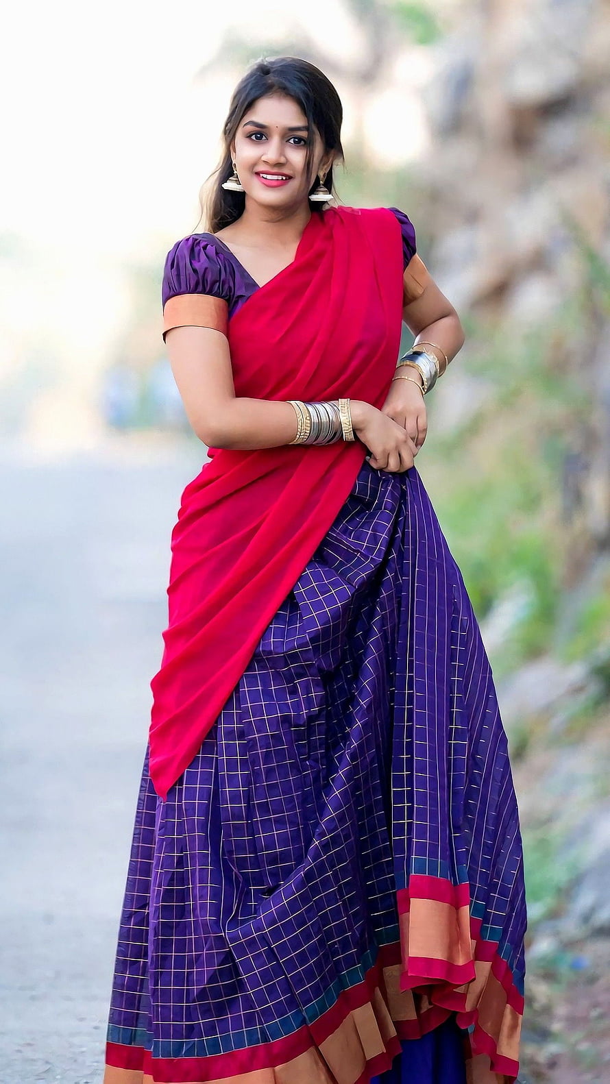 Sanjana Anand in a vibrant red and purple checkered saree with traditional gold bangles HD phone wallpaper