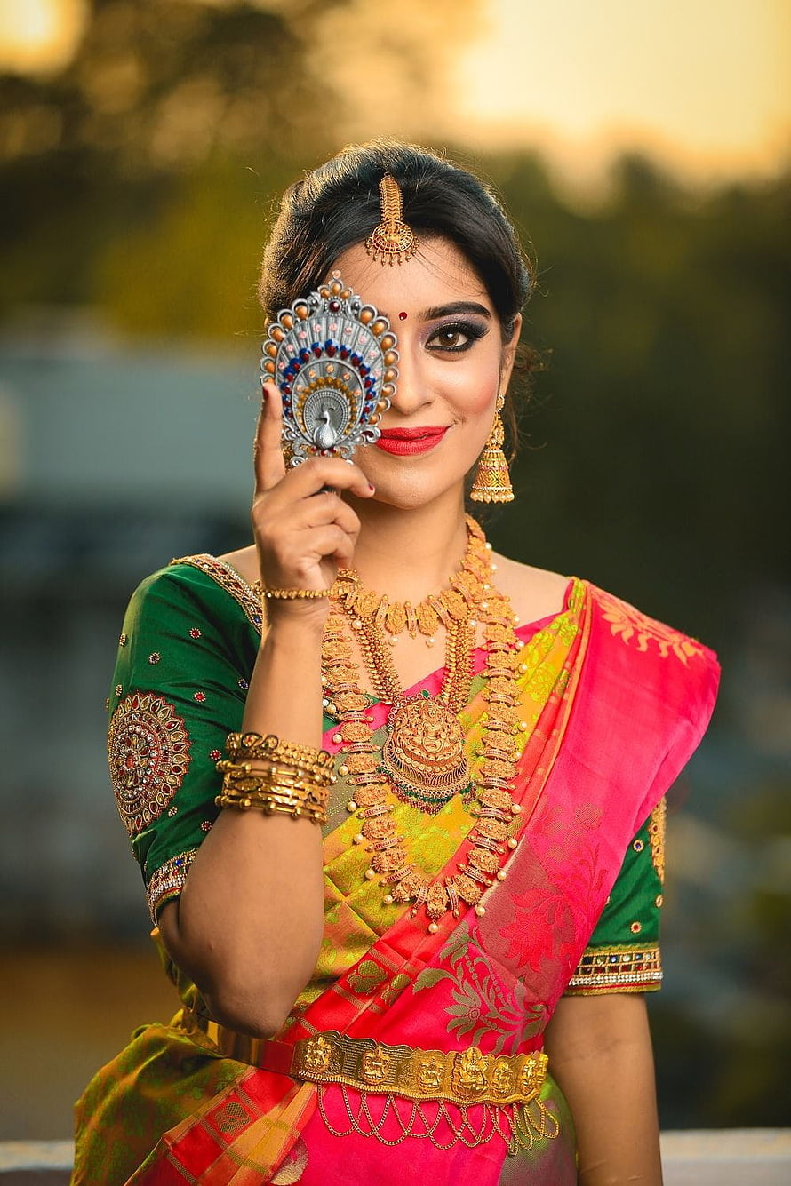 Indian Bride in Traditional Saree and Gold Jewelry Holding Decorative Mirror HD phone wallpaper