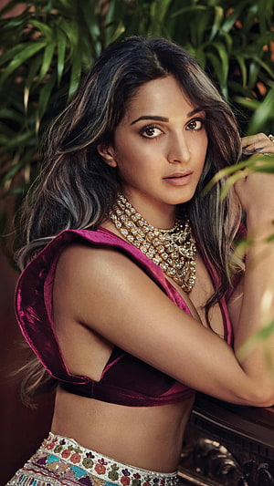 Kiara Advani in a deep pink velvet crop top with layered gold jewelry and floral embroidered skirt HD phone wallpaper