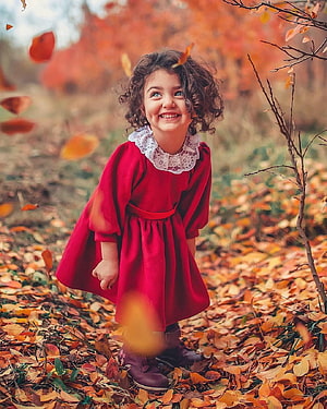 Happy Little Girl in Red Dress Playing in Autumn Leaves HD phone wallpaper