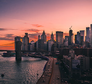 Brooklyn Bridge and Lower Manhattan Skyline at Sunset Over the East River HD wallpaper
