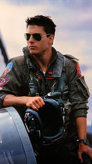 Tom Cruise as Maverick in Top Gun Flight Suit and Aviator Sunglasses HD phone wallpaper