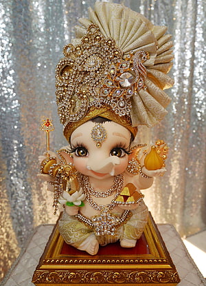 Adorable Baby Ganesha Idol with Golden Crown and Jewels HD phone wallpaper