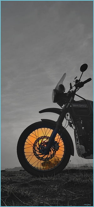 Royal Enfield Himalayan Motorcycle Silhouette Against Vibrant Sunset Sky HD phone wallpaper