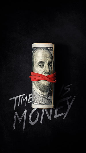 Rolled hundred dollar bill with red ribbon and time is money text on dark background HD phone wallpaper