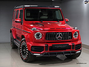 Red Mercedes-Benz G-Class SUV with Black Accents and AMG Grille in Studio Setting HD wallpaper