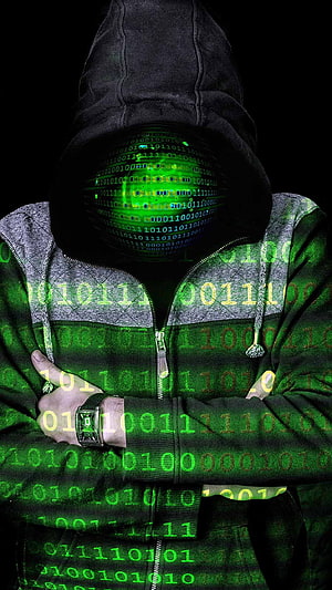Hacker in Hoodie with Glowing Green Binary Code Overlay and Digital Matrix Effect HD phone wallpaper