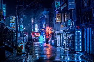 Neon-Lit Seoul Street at Night with Rain-Soaked Reflections and Korean Signage HD wallpaper