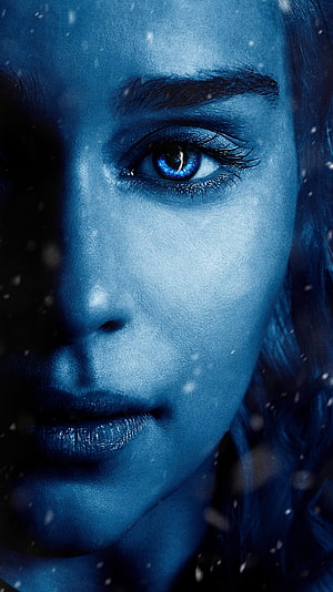 Close-up portrait of a woman with glowing blue eyes and blue skin in a snowy atmosphere, Emilia Clarke, hollywood actress, model HD phone wallpaper