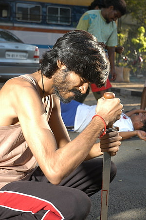 Dhanush in Pudhupettai Still with Bloodied Machete on Street HD phone wallpaper