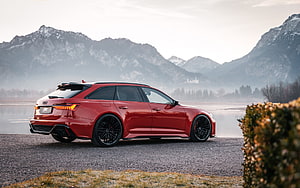 Red ABT Audi RS6 Avant Station Wagon Parked on Gravel with Misty Mountain Backdrop HD wallpaper