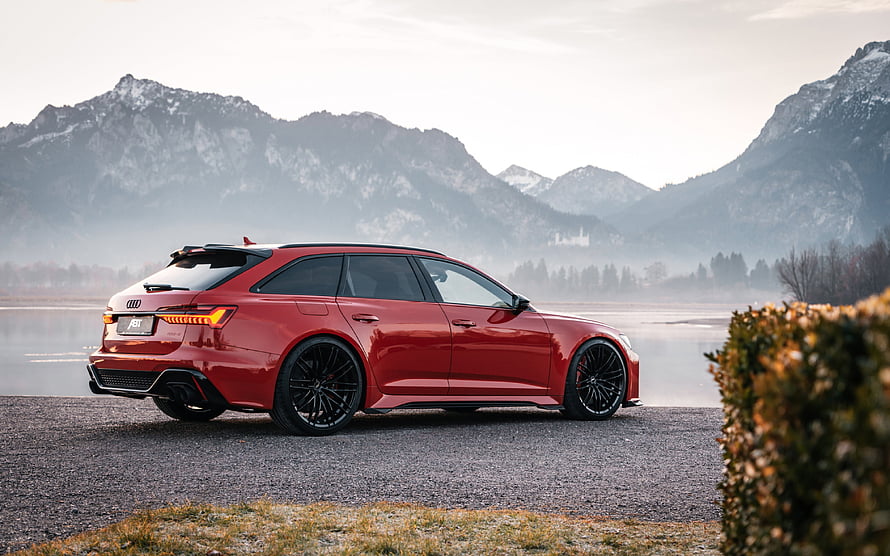Red ABT Audi RS6 Avant Station Wagon Parked on Gravel with Misty Mountain Backdrop HD wallpaper
